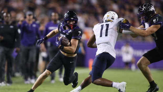 Sep 30, 2023; Fort Worth, Texas, USA; TCU Horned Frogs quarterback Chandler Morris (4) runs the ball against West Virginia Mountaineers cornerback Beanie Bishop Jr. (11) in the second quarter at Amon G. Carter Stadium. Mandatory Credit: Tim Heitman-USA TODAY Sports