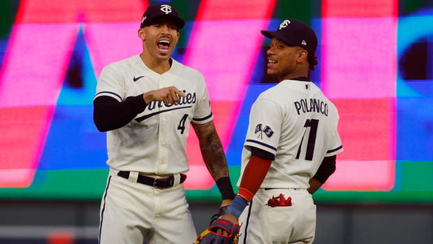 Twins players Carlos Correa (4) and Jorge Polanco (11) celebrate after a 3–1 win over the Blue Jays in Game 1 of an AL Wild Card playoff series.