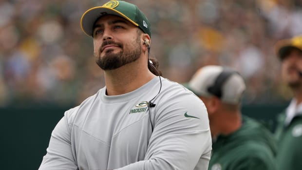 Packers offensive tackle David Bakhtiari looks on while inactive during a game.
