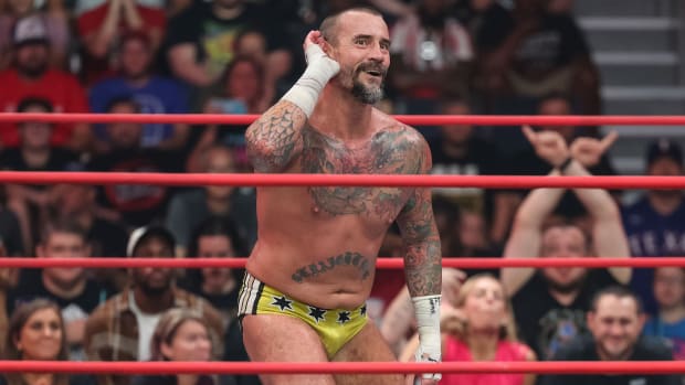 CM Punk taunts the crowd during an AEW match