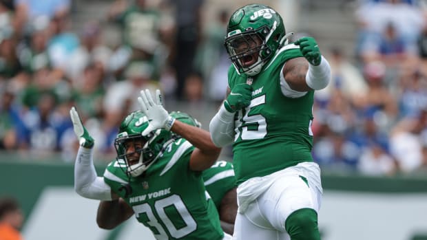 New York Jets defensive tackle Quinnen Williams (95) celebrates his sack with cornerback Michael Carter II (30) during the first half against the New York Giants at MetLife Stadium.