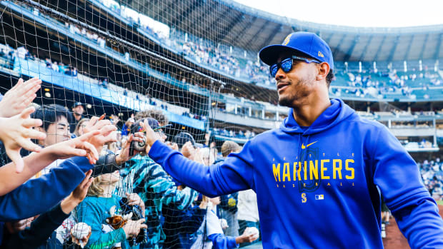 Oct 1, 2023; Seattle, Washington, USA; Seattle Mariners center fielder Julio Rodriguez (44) high-fives fans following a 1-0 victory against the Texas Rangers at T-Mobile Park.