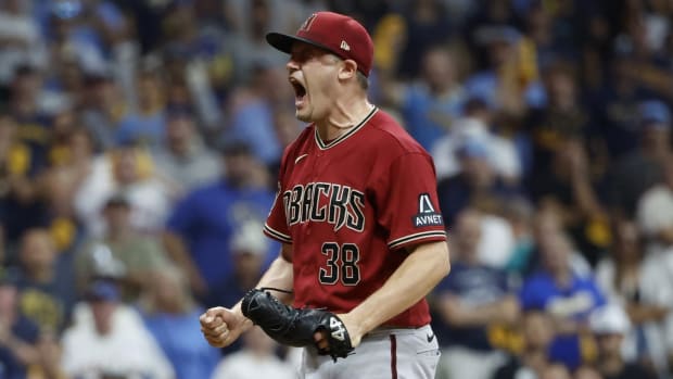 Arizona Diamondbacks closer Paul Sewald (38) celebrates after striking out Milwaukee Brewers catcher William Contreras (not pictured) for the final out of the Wild Card Series.