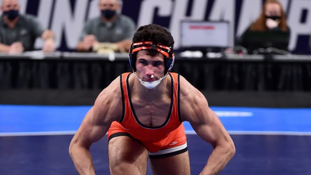 Mar 20, 2021; St. Louis, Missouri, USA; Oklahoma State Cowboys wrestler AJ Ferrari celebrates after defeating Pittsburgh Panthers wrestler Nino Bonaccorsi in the championship match of the 197 weight class during the finals of the NCAA Division I Wrestling Championships at Enterprise Center. Mandatory Credit: Jeff Curry-USA TODAY Sports