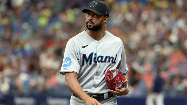 Marlins pitcher Sandy Alcantara walks off the field during a game.