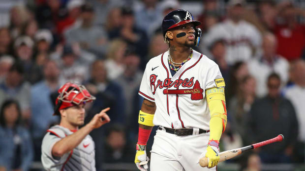 Oct 7, 2023; Cumberland, Georgia, USA; Atlanta Braves right fielder Ronald Acuna Jr. (13) reacts after striking out during the fifth inning against the Philadelphia Phillies during game one of the NLDS for the 2023 MLB playoffs at Truist Park.