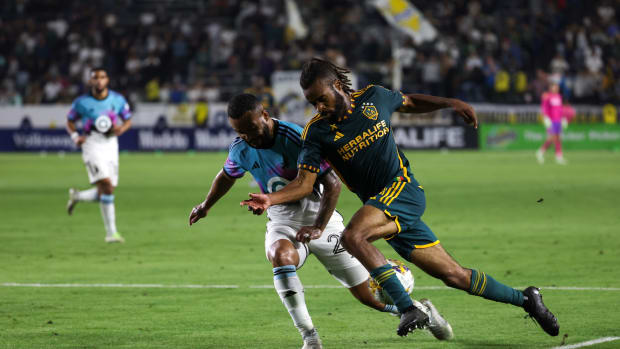 Sep 20, 2023; Carson, California, USA; Los Angeles Galaxy forward Raheem Edwards (44) fights for the ball against Minnesota United FC defender D.J. Taylor (27) during the second half at Dignity Health Sports Park. Mandatory Credit: Kiyoshi Mio-USA TODAY Sports
