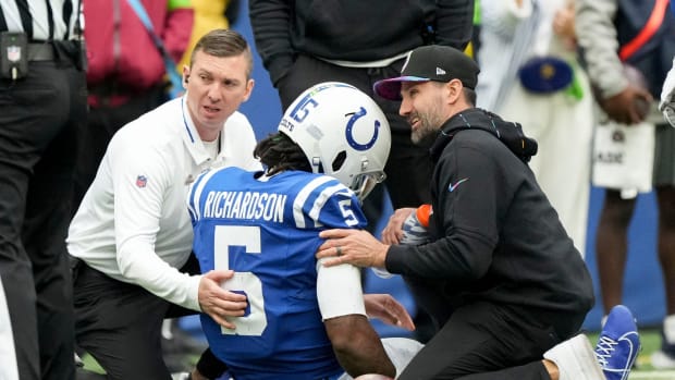 Team personnel tend to Indianapolis Colts quarterback Anthony Richardson (5) after hurting his shoulder Sunday, Oct. 8, 2023, during a game against the Tennessee Titans at Lucas Oil Stadium in Indianapolis.  