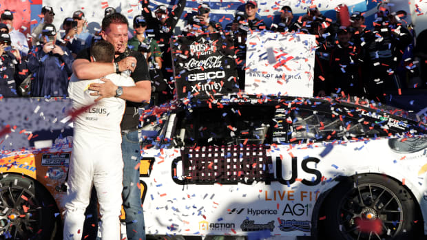 AJ Allmendinger hugs Kaulig Racing owner Matt Kaulig in victory lane after "Dinger" won Sunday's NASCAR Cup Series Bank of America ROVAL 400 at Charlotte Motor Speedway. (Photo by Keenan Hairston/Getty Images)
