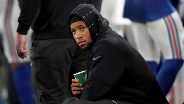 Oct 2, 2023; East Rutherford, New Jersey, USA; New York Giants running back Saquon Barkley (26) watches from the sidelines during the fourth quarter against the Seattle Seahawks at MetLife Stadium.