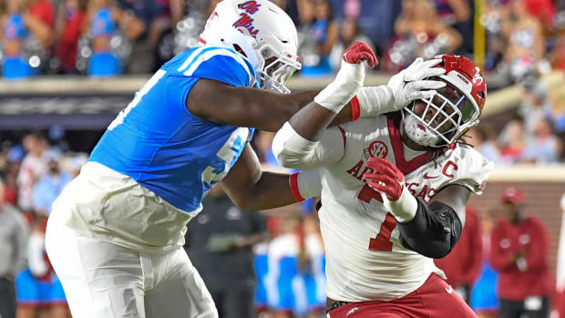 Razorbacks' defensive end Trajan Jeffcoat trying to get into backfield against Ole Miss
