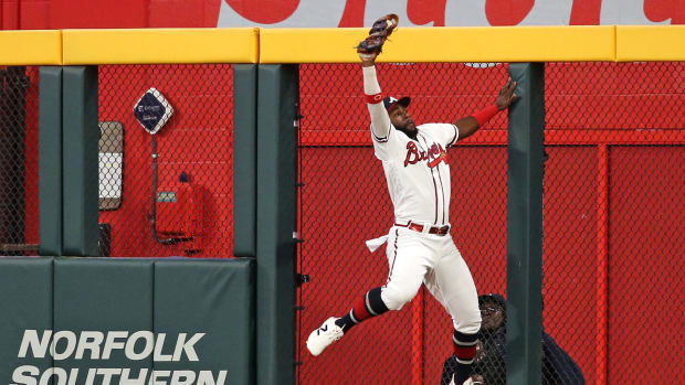 Oct 9, 2023; Cumberland, Georgia, USA; Atlanta Braves center fielder Michael Harris II (23) makes a catch at the wall for an out during the ninth inning against the Philadelphia Phillies in game two of the NLDS for the 2023 MLB playoffs at Truist Park.