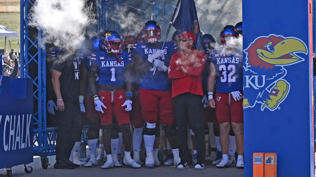 Oct 7, 2023; Lawrence, Kansas, USA; Kansas Jayhawks head coach Lance Leipold (right) waits to enter the field with his team before a game against the UCF Knights at David Booth Kansas Memorial Stadium. Mandatory Credit: Peter Aiken-USA TODAY Sports  