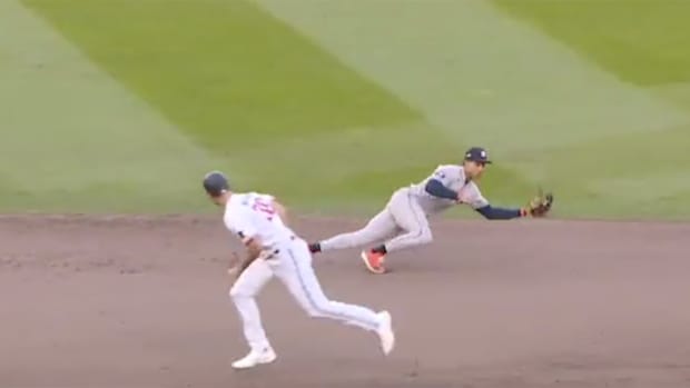 Astros shortstop Jeremy Pena makes a diving stop and turns a double play vs. the Twins.