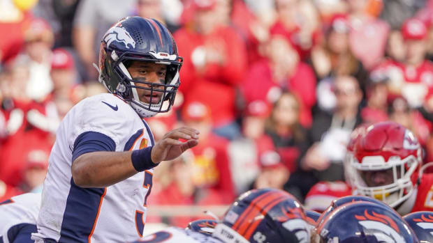Denver Broncos quarterback Russell Wilson (3) at the line of scrimmage against the Kansas City Chiefs during a game at GEHA Field at Arrowhead Stadium.
