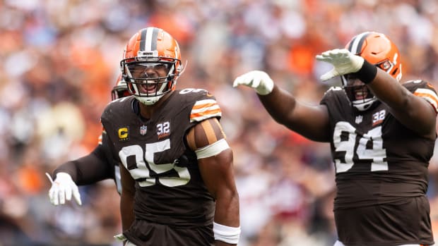 Sep 24, 2023; Cleveland, Ohio, USA; Cleveland Browns defensive end Myles Garrett (95) celebrates a sack with defensive tackle Dalvin Tomlinson (94) during the second quarter against the Tennessee Titans at Cleveland Browns Stadium. Mandatory Credit: Scott Galvin-USA TODAY Sports