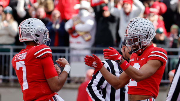 Nov 20, 2021; Columbus, Ohio, USA; Ohio State Buckeyes wide receiver Chris Olave (2) celebrates with Ohio State Buckeyes quarterback C.J. Stroud (7) after he scores a touchdown in the first half against the Michigan State Spartans at Ohio Stadium.