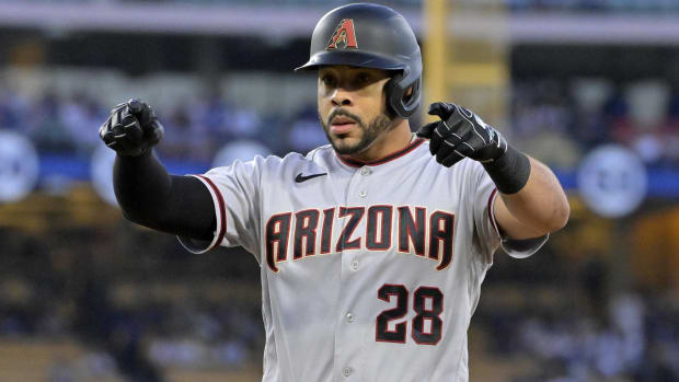 Diamondbacks outfielder Tommy Pham signals to the dugout during a game vs. the Dodgers.