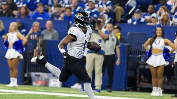 Sep 10, 2023; Indianapolis, Indiana, USA; Jacksonville Jaguars running back Travis Etienne Jr. (1) scores a touchdown in the second half against the Indianapolis Colts at Lucas Oil Stadium.