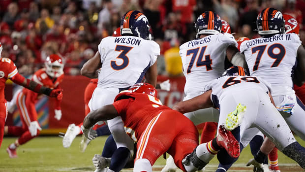 Denver Broncos quarterback Russell Wilson (3) is sacked by Kansas City Chiefs defensive tackle Chris Jones (95) during the first half at GEHA Field at Arrowhead Stadium.