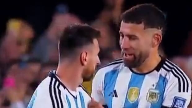 Lionel Messi pictured receiving the captain's armband from Nicolas Otamendi during Argentina's 1-0 win over Paraguay in October 2023