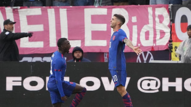Christian Pulisic pictured (right) celebrating after scoring for the USA against Germany in an international friendly in October 2023