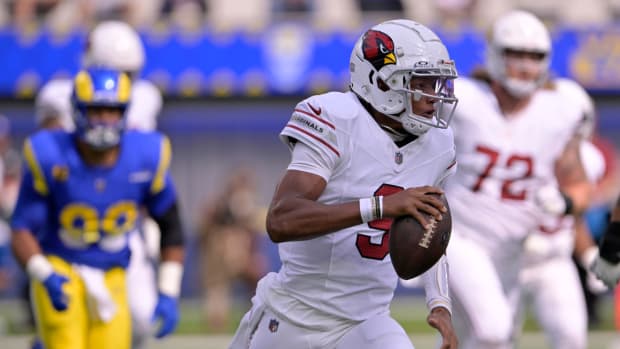 Arizona Cardinals quarterback Joshua Dobbs (9) scrambles out of the pocket to run against the Los Angeles Rams during the first quarter at SoFi Stadium.