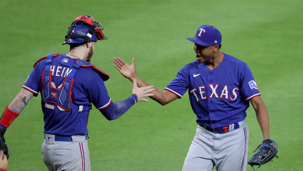 Oct 15, 2023; Houston, Texas, USA; Texas Rangers catcher Jonah Heim (28) and pitcher Jose Leclerc (25) celebrate after winning game one of the ALCS against the Houston Astros in the 2023 MLB playoffs at Minute Maid Park.