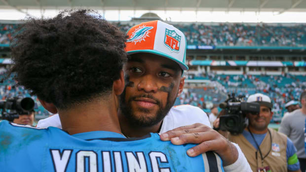 Miami Dolphins quarterback Tua Tagovailoa, right, and Carolina Panthers quarterback Bryce Young (9) hug after the game at Hard Rock Stadium.