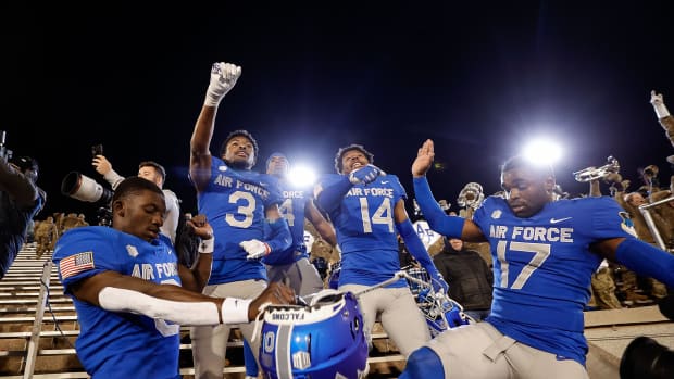 Oct 14, 2023; Colorado Springs, Colorado, USA; Air Force Falcons defensive back Trey Williams (0) and defensive back Jamari Bellamy (3) and fullback Emmanuel Michel (4) and defensive back K.C. Beard (14) and cornerback Zion Kelly (17) celebrate after the game against the Wyoming Cowboys at Falcon Stadium. Mandatory Credit: Isaiah J. Downing-USA TODAY Sports  