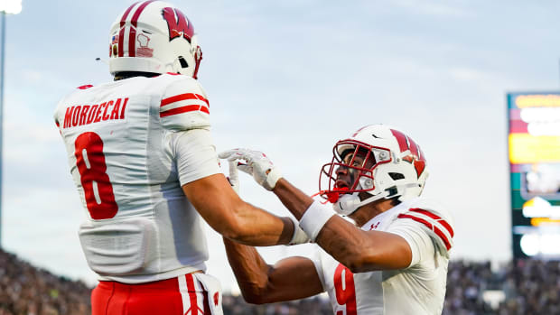 Sep 22, 2023; West Lafayette, Indiana, USA; Wisconsin Badgers quarterback Tanner Mordecai (8) celebrates with Wisconsin Badgers wide receiver Bryson Green (9) after running for a touchdown during the first half at Ross-Ade Stadium. Mandatory Credit: Robert Goddin-USA TODAY Sports