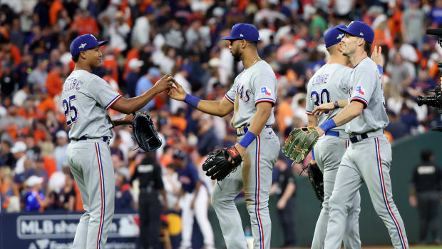 Oct 16, 2023; Houston, Texas, USA; Texas Rangers center fielder Leody Taveras (3) and relief pitcher Jose Leclerc (25) celebrate with teammates after defeating the Houston Astros in game two of the ALCS for the 2023 MLB playoffs at Minute Maid Park. Mandatory Credit: Thomas Shea-USA TODAY Sports