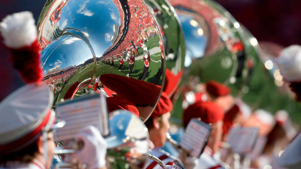 Oct 25, 2008; Madison, WI, USA; A reflection in a tuba of the Wisconsin marching band performing prior to the game against Illinois at Camp Randall Stadium. Wisconsin defeated Illinois 27-17. Mandatory Credit: Jeff Hanisch-USA TODAY Sports