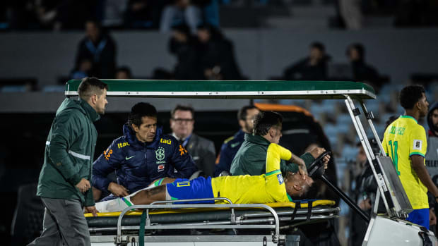 Brazil captain Neymar pictured crying as he leaves the pitch on a stretcher after suffering an injury to his left knee during a game against Uruguay in October 2023