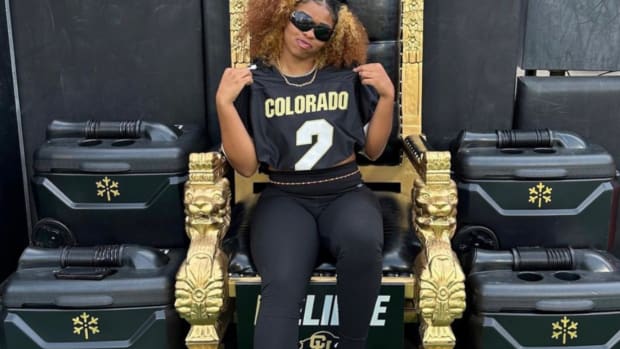 Sheomi Sanders on the turnover throne on the sidelines at CU