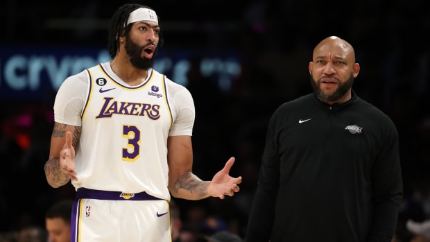 Los Angeles Lakers head coach Darvin Ham and forward Anthony Davis talk during the game against the Golden State Warriors.