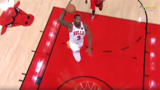 Bulls center Andre Drummond attempting a dunk.
