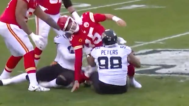 Kansas City Chiefs quarterback Patrick Mahomes is brought down with a "hip-drop" tackle by Corey Peters of the Jacksonville Jaguars in a Sept. 17, 2023 game.