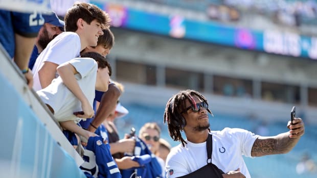 Oct 15, 2023; Jacksonville, Florida, USA; Indianapolis Colts quarterback Anthony Richardson (5) smiles and takes photos with fans before the game against the Jacksonville Jaguars at EverBank Stadium.