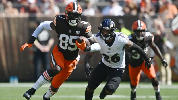 Oct 1, 2023; Cleveland, Ohio, USA; Cleveland Browns tight end David Njoku (85) runs with the ball after a catch as Baltimore Ravens safety Geno Stone (26) defends during the first quarter at Cleveland Browns Stadium.