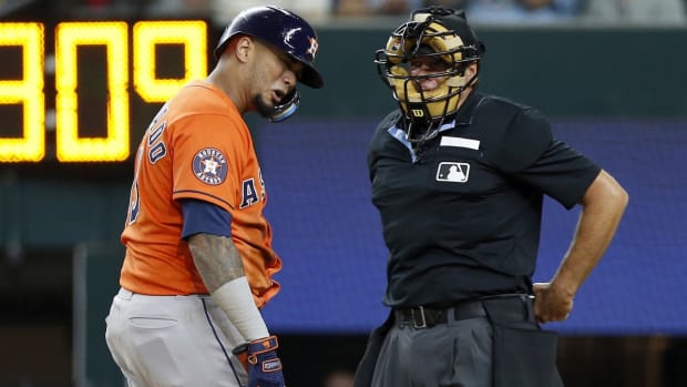 Oct 18, 2023; Arlington, Texas, USA; Houston Astros catcher Martin Maldonado (15) talks to home plate umpire James Hoye after striking out during the fourth inning of game three of the ALCS against the Texas Rangers in the 2023 MLB playoffs at Globe Life Field. Mandatory Credit: Andrew Dieb-USA TODAY Sports