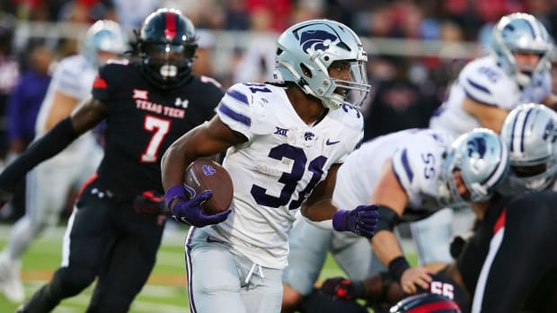 Oct 14, 2023; Lubbock, Texas, USA; Kansas State Wildcats running back Dj Giddens (31) rushes against the Texas Tech Red Raiders in the first half at Jones AT&T Stadium and Cody Campbell Field.