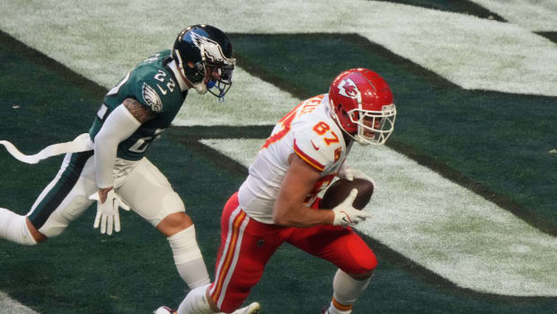 Chiefs tight end Travis Kelce scores with Eagles safety Marcus Epps in pursuit during Kansas City's 38-35 win over Philadelphia in Super Bowl LVII on Feb. 12, 2023.