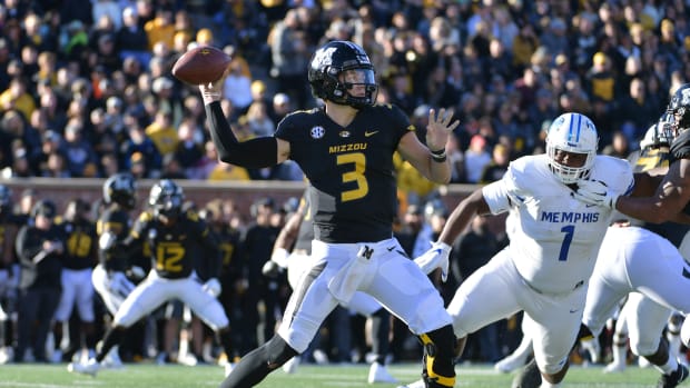 Missouri Tigers quarterback Drew Lock (3) throws a pass as Memphis Tigers defensive lineman O'Bryan Goodson (1) pressures during the first half at Memorial Stadium/Faurot Field in 2018.