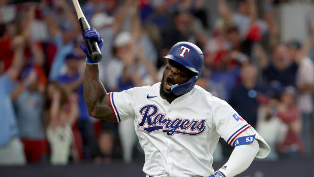 Texas Rangers right fielder Adolis Garcia celebrates a three-run home run during the sixth inning of Game 5 in the ALCS against the Houston Astros at Globe Life Field. Garcia left Game 3 of the World Series Monday with an oblique strain and will miss the rest of the postseason.