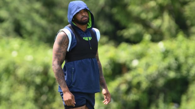 Seahawks safety Jamal Adams stands on the sidelines while rehabbing an injury during practice.