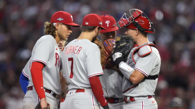 Philadelphia Phillies players meet during the seventh inning against the Arizona Diamondbacks in Game 4 of the NLCS of the 2023 MLB playoffs at Chase Field in Phoenix on Oct. 20, 2023.