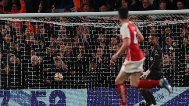 Arsenal midfielder Declan Rice pictured watching on as his shot from long range flies past Chelsea goalkeeper Robert Sanchez in an EPL game at Stamford Bridge in October 2023