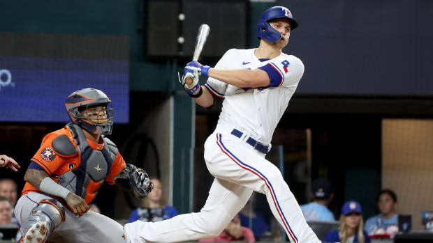 Texas Rangers shortstop Corey Seager doubles during the sixth inning of Game 5 in the ALCS against the Houston Astros Friday at Globe Life Field.