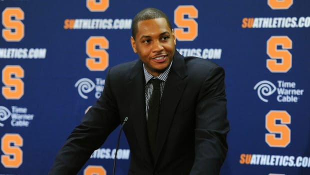 Syracuse men’s basketball great Carmelo Anthony gives a press conference at the school in 2013.